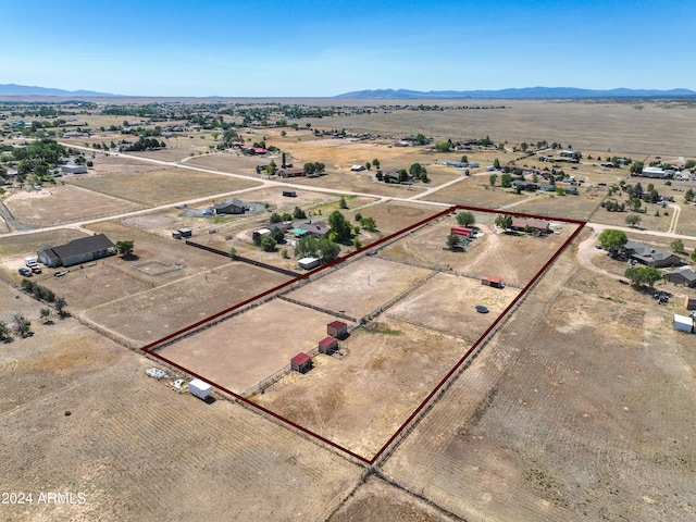 birds eye view of property with a mountain view