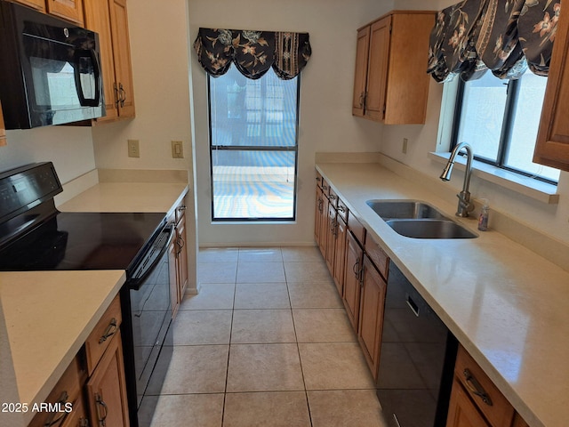 7420 W Morrow Dr, Glendale, AZ 85308 - kitchen featuring black appliances, brown cabinets, and light countertops