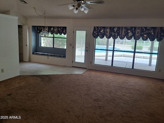 7420 W Morrow Dr, Glendale, AZ 85308 - carpeted spare room with a chandelier, tile patterned flooring, and a ceiling fan
