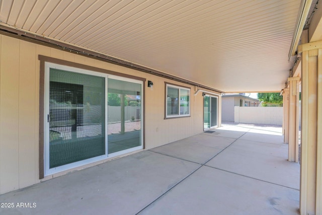 view of patio featuring fence