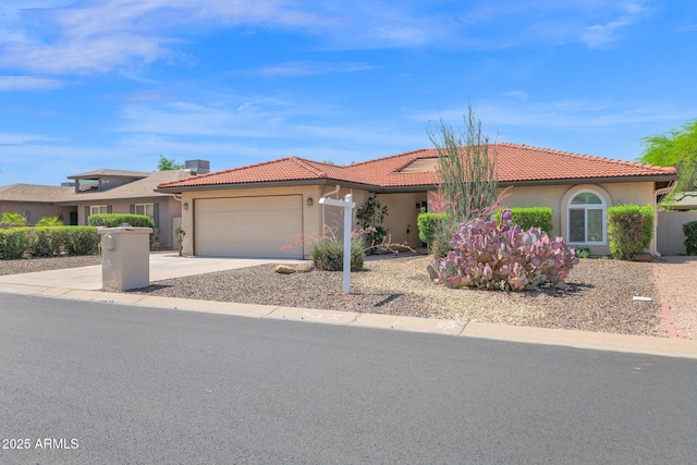 view of front facade featuring an attached garage, a tiled roof, stucco siding, and driveway