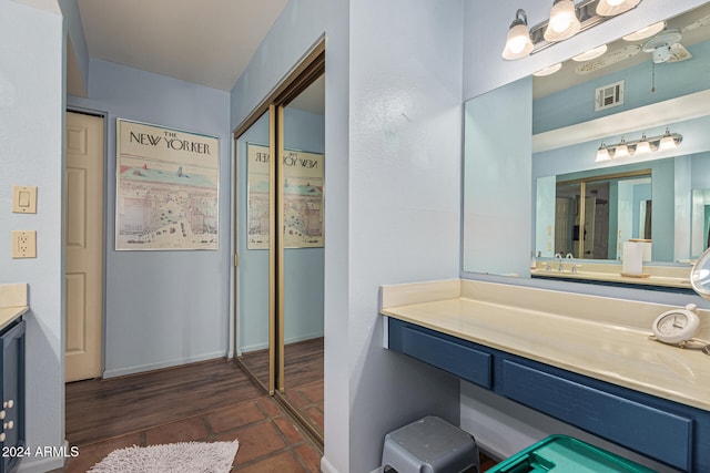 bathroom with vanity and wood-type flooring