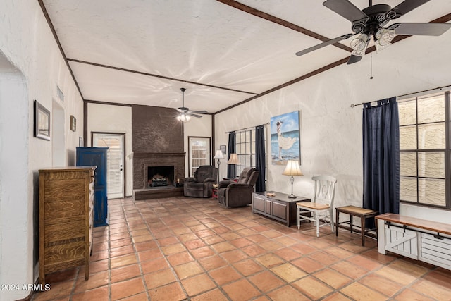 living room featuring a fireplace and crown molding