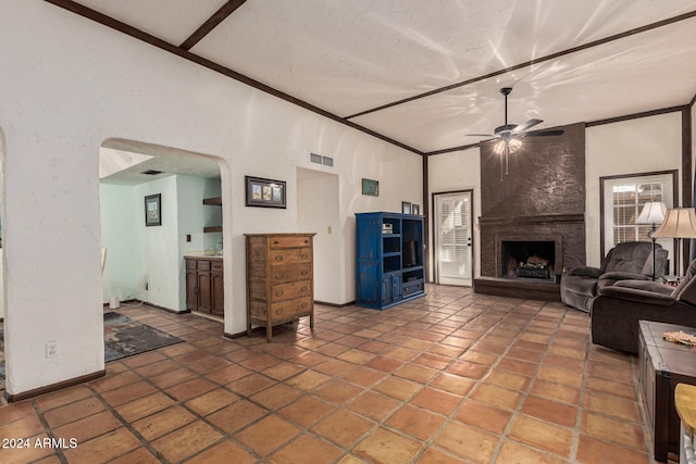 living room featuring beam ceiling, ceiling fan, a fireplace, and high vaulted ceiling