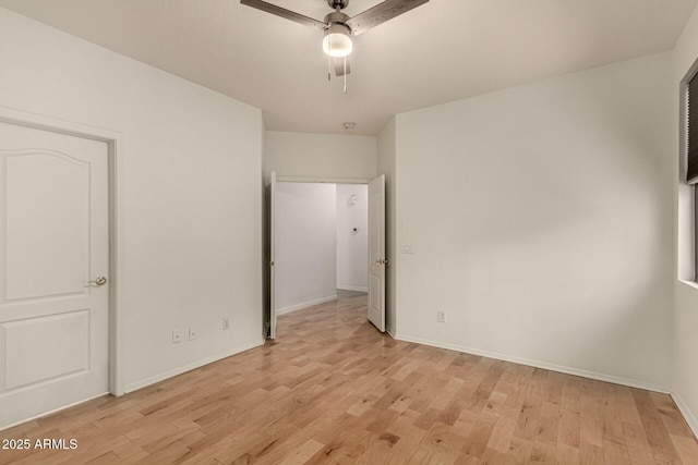 unfurnished bedroom with ceiling fan and light hardwood / wood-style flooring