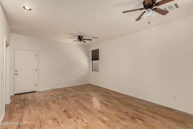 empty room with ceiling fan and light wood-type flooring