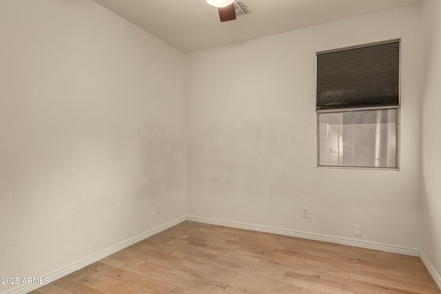 empty room with light hardwood / wood-style floors and ceiling fan