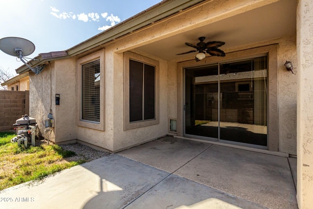 exterior space featuring ceiling fan