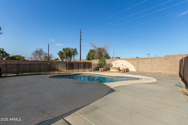 view of swimming pool featuring a patio