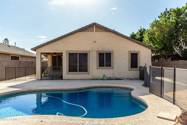 view of pool featuring ceiling fan and a patio