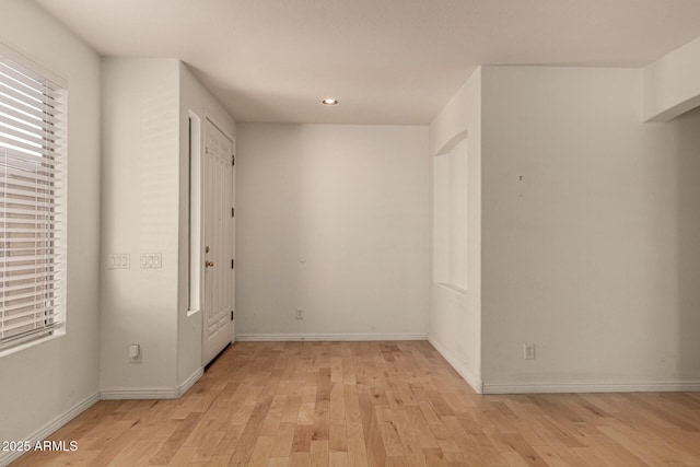 unfurnished room featuring light hardwood / wood-style flooring