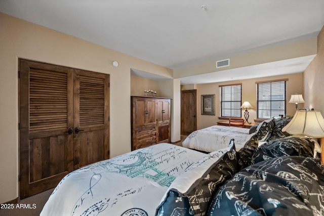 bedroom featuring visible vents