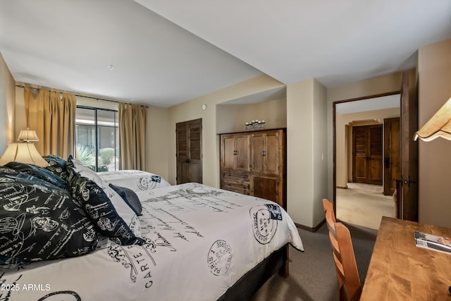 carpeted bedroom featuring baseboards