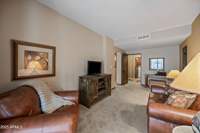 living room with visible vents and light colored carpet