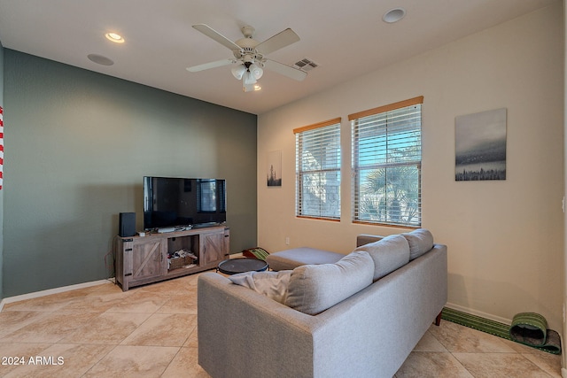 living room featuring ceiling fan and light tile patterned flooring