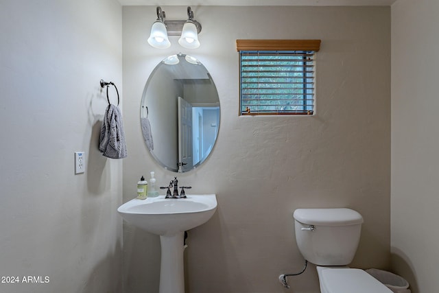 bathroom with toilet and sink