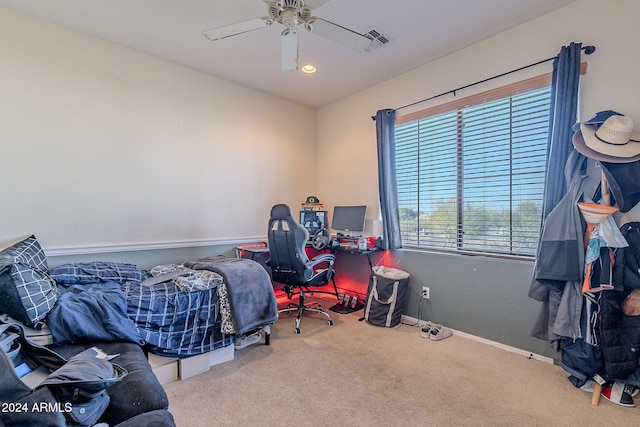 carpeted bedroom with ceiling fan