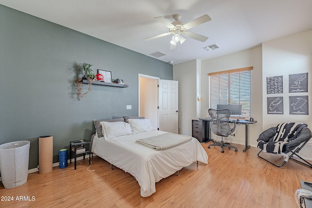 bedroom with wood-type flooring and ceiling fan