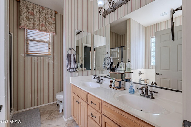 bathroom featuring tile patterned flooring, vanity, and toilet