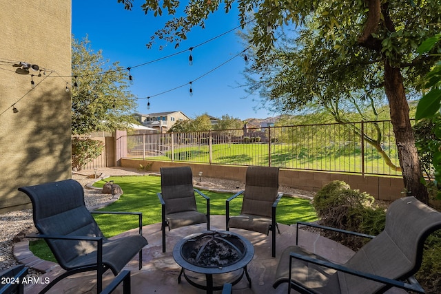 view of patio featuring an outdoor fire pit