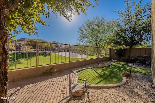 exterior space featuring a lawn and a patio area