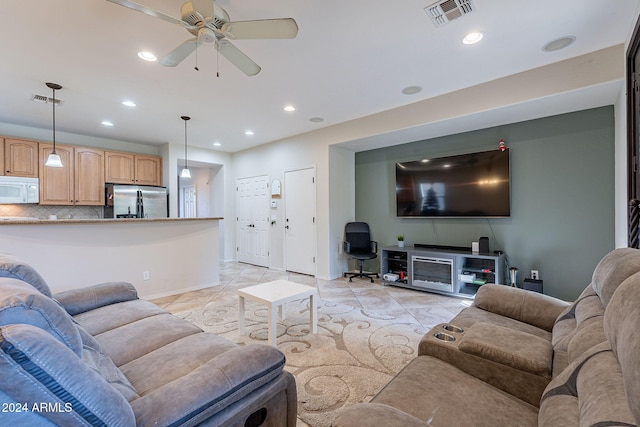 tiled living room featuring ceiling fan