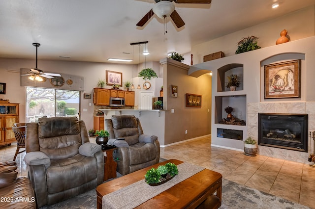 5461 N Bremont Way, Prescott Valley, AZ 86314 - living room with ceiling fan, light tile patterned flooring, and a fireplace