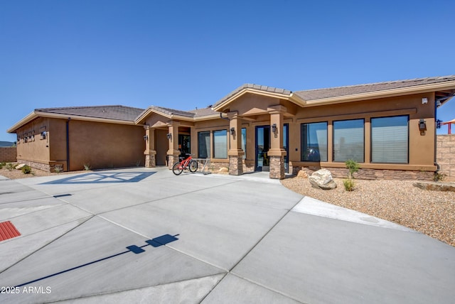 5461 N Bremont Way, Prescott Valley, AZ 86314 - view of front of home featuring stone siding, stucco siding, and a tiled roof