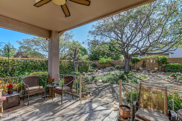5461 N Bremont Way, Prescott Valley, AZ 86314 - fenced backyard with ceiling fan and a patio