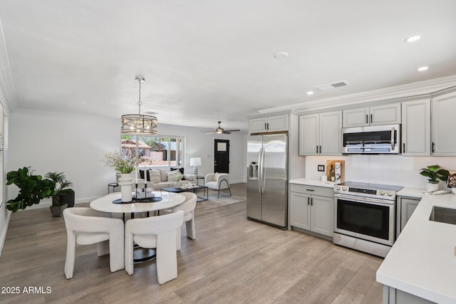 7049 E Latham St, Scottsdale, AZ 85257 - kitchen with appliances with stainless steel finishes, light wood-type flooring, light countertops, baseboards, and recessed lighting