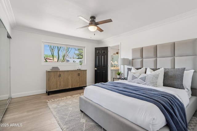 7049 E Latham St, Scottsdale, AZ 85257 - bedroom featuring wood finished floors, ornamental molding, baseboards, and ceiling fan