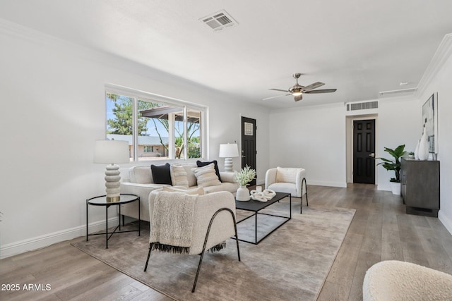 7049 E Latham St, Scottsdale, AZ 85257 - living room with wood finished floors, ornamental molding, a ceiling fan, and baseboards