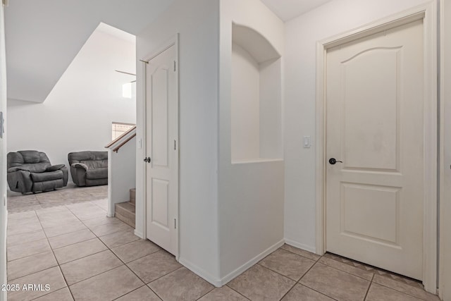 hallway with light tile patterned floors