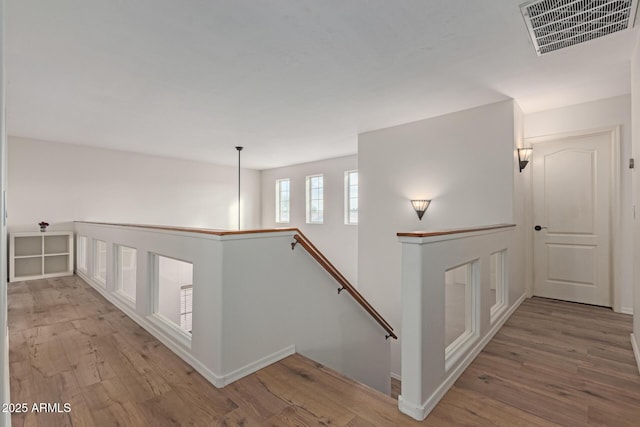 hallway with light wood-type flooring