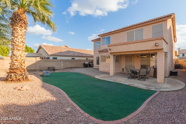 rear view of property featuring a patio