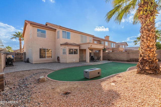 back of property featuring a patio