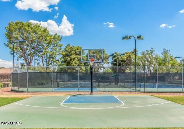 view of basketball court featuring tennis court