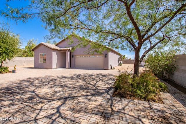 view of front of property featuring a garage