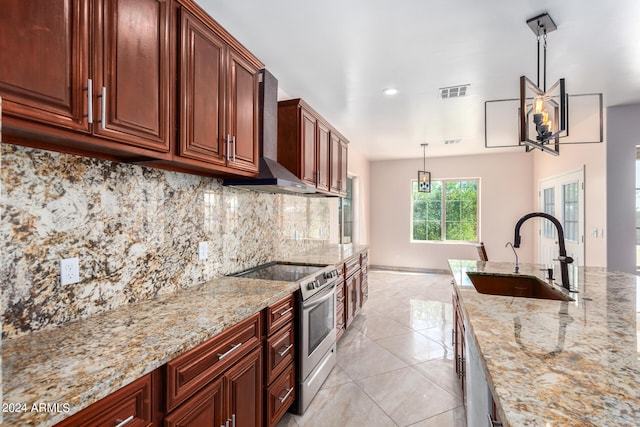 kitchen with decorative backsplash, electric stove, light stone countertops, decorative light fixtures, and sink