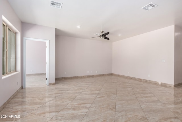 unfurnished room featuring ceiling fan