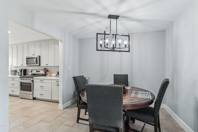 dining space featuring a notable chandelier