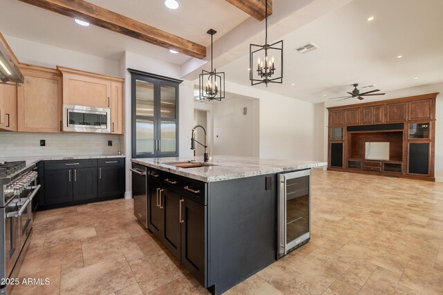 3971 E Leo Pl, Chandler, AZ 85249 - kitchen with beverage cooler, a sink, stainless steel appliances, decorative backsplash, and a chandelier