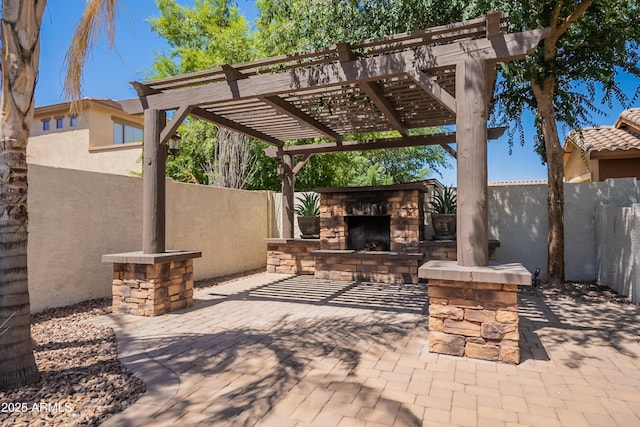 3971 E Leo Pl, Chandler, AZ 85249 - view of patio / terrace featuring an outdoor stone fireplace and a fenced backyard