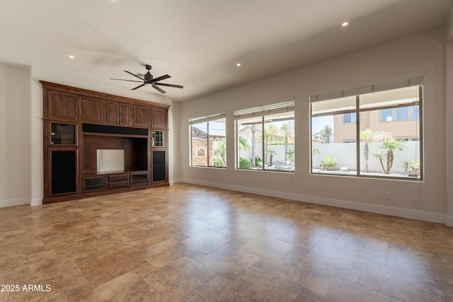 3971 E Leo Pl, Chandler, AZ 85249 - unfurnished living room with baseboards, a ceiling fan, light stone finish floors, and recessed lighting