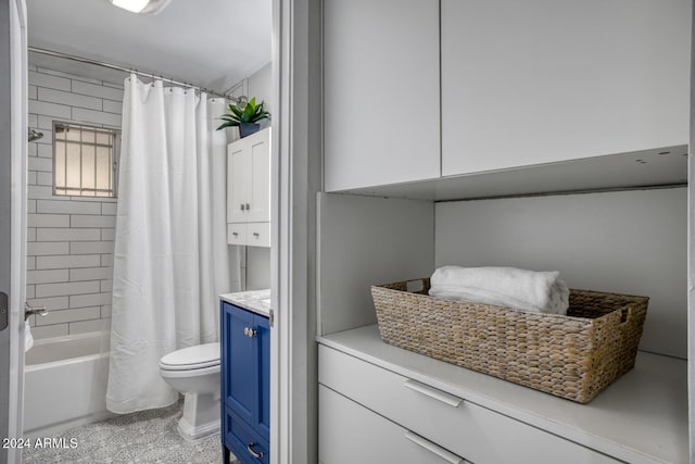 full bathroom featuring vanity, toilet, and shower / bathtub combination with curtain