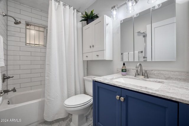 full bathroom featuring vanity, toilet, and shower / tub combo