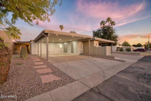 view of front of home featuring a carport