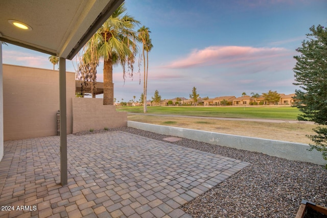 view of patio terrace at dusk