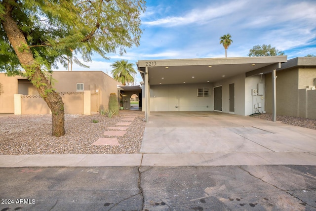 pueblo-style house with a carport