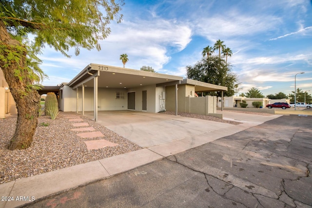 view of front of home with a carport